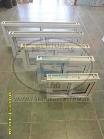 Ventana de aluminio 1.50 x 1.10 con guia y rejas.