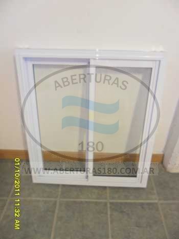 Ventana de aluminio 1.50 x 1.10 con guia y rejas.